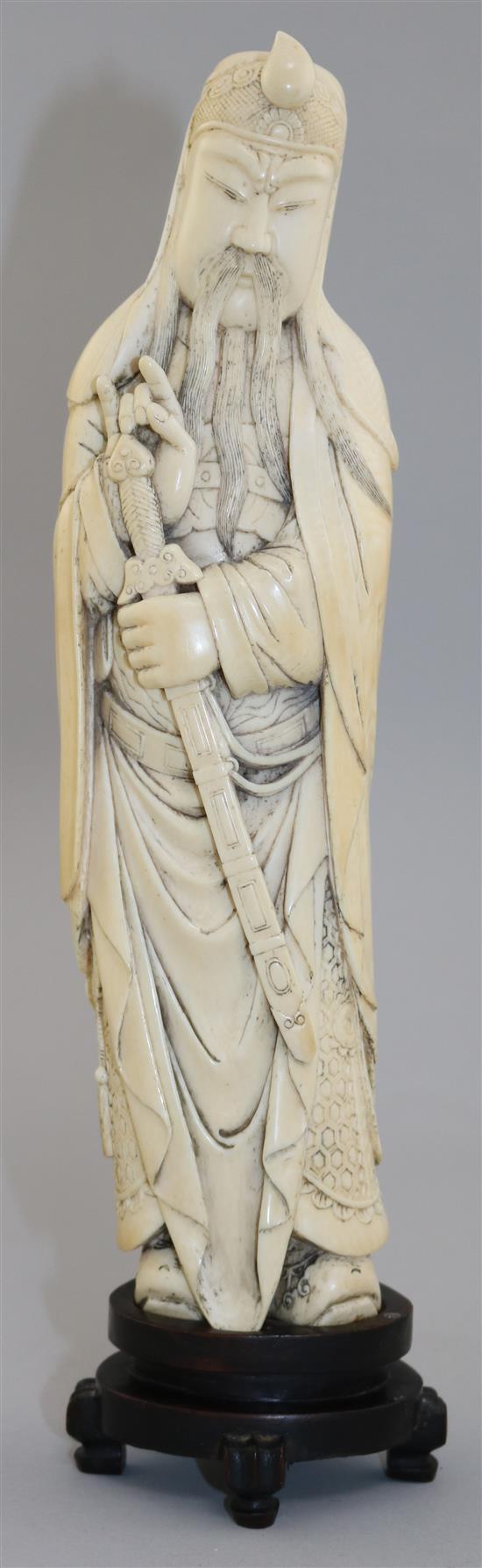 A Chinese ivory tusk figure of Lu Dongbin, late 19th / early 20th century, total height 30.5cm